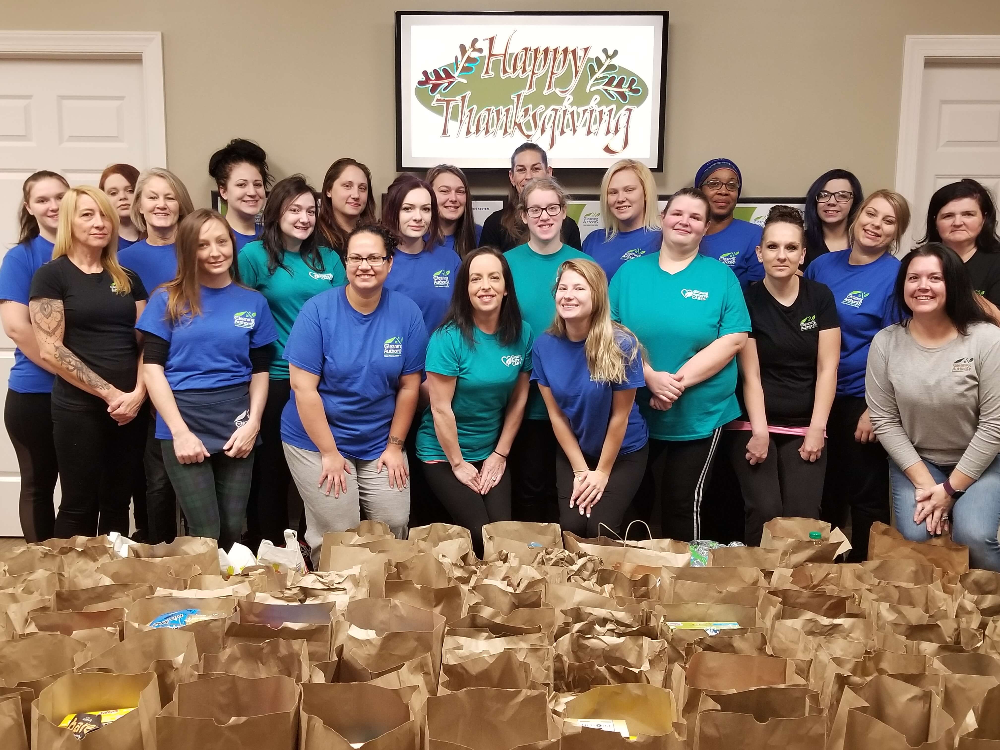 The TCA Broadview Heights team poses with the food donations collected for local charities.